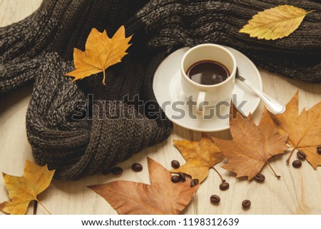 Cup of hot coffee in autumn