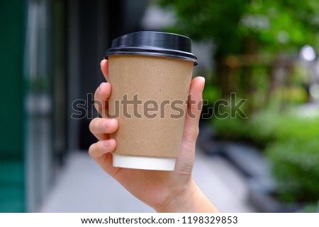 A paper cup of hot drink Royalty-Free Stock Photo #1198329853