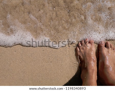 Walking barefoot on the beach