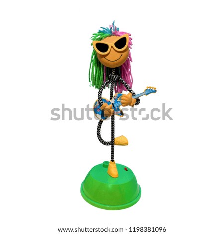 Dancing doll playing guitar on white background.Dancing doll playing guitar on white.