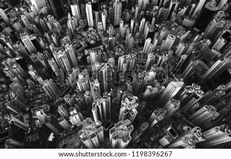 Black and white of aerial view of Hong Kong Downtown. Financial district and business centers in smart city in Asia. Top view of skyscraper and high-rise buildings.
