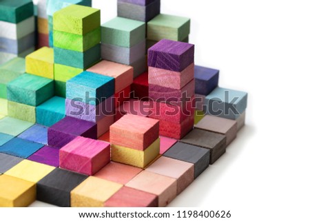 Spectrum of stacked multi-colored wooden blocks. Background or cover for something creative, diverse, expanding,  rising or growing. On pure white.