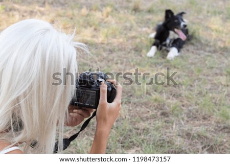 Attractive young woman taking pictures