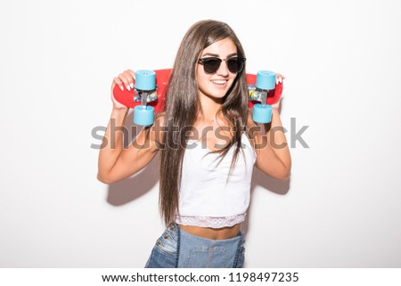 Funny woman posing with skateboard isolated on a white background