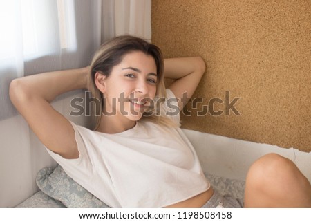 Woman waking up in bed