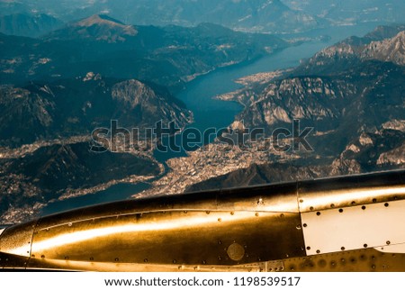 retro style film like photo from the aircraft, view of Lago di Como, Italy