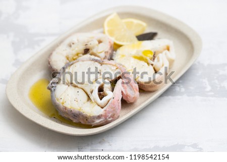 boiled fish with lemon and olive oil