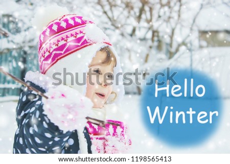 A child plays in the snow in the winter. Selective focus. nature.