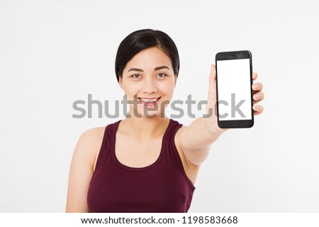 portrait of smile asian,korean woman,girl hold blank screen cellphone,  isolated on white background, hand holding black phone,selective focus, copy space