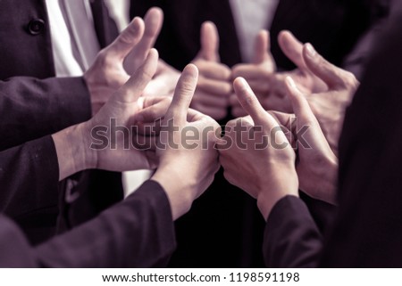 Businessmen showing thumbs up - closeup shot,Successful thumbs up after good deal. businessman thumbs up. Image of hands in circle as symbol of their partnership and teamwork, well done concept.