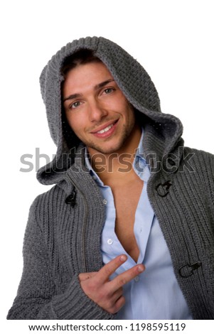Good looking young man wearing winter hoodie sweater on shirt