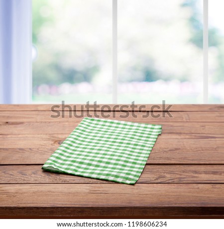 Easter table with spring background in a sunny April kitchen