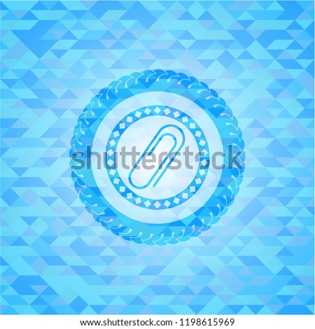 paper clip icon inside sky blue emblem with mosaic background
