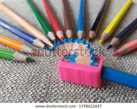 pink sharpener with colored pencil