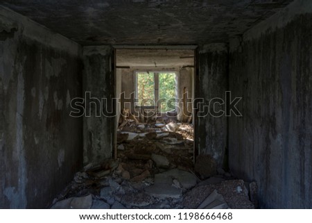 Old dirty broken ruined abandoned building inside among Bog, Facade ruins of industrial factory. Alley way with moss illuminated by sunlight. Royalty-Free Stock Photo #1198666468