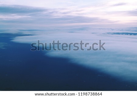 beautiful colorful sunset above the clouds