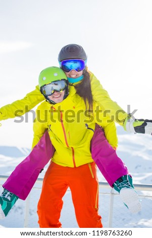 Photo of Funny sporty woman and man against backdrop of mountains