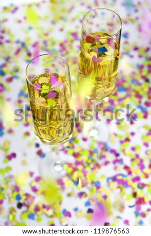 Two glasses of  wine and falling confetti
