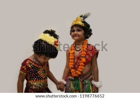 Cute Indian girls dressed as "RAADHA" and "KRISHNA" and posing naturally. 