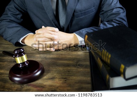 justice and law concept.Male judge in a courtroom working on wood table with documents., attorney court judge justice gavel legal legislation concept