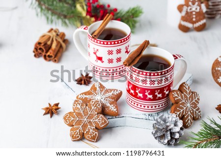 hot winter tea with cinnamon, star anise and ginger cookies Royalty-Free Stock Photo #1198796431