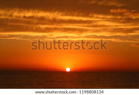 Super beautiful sunset on the sea in the autumn evening