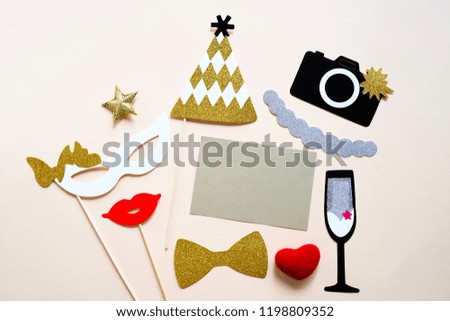 Cute party props and blank card on colorful background, happy new year party celebration and holiday concept