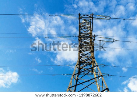 Power transmission pylon against blue sky