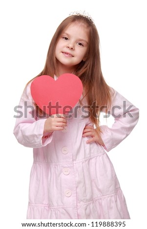 Cute kid holding red heart card on St.Valentine holiday theme