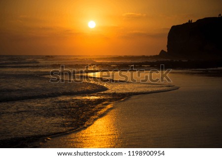 Amazing orange sunset at the beach