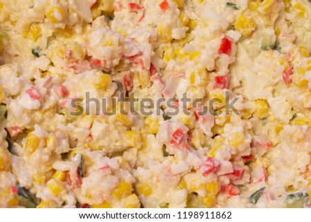Traditional salad with cooked vegetables with mayonnaise. Top view as background