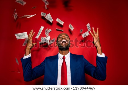 Attractive multiethnic man in style chic classy jacket blue formalwear  trendy tux tuxedo stand with closed eyes under money fly rain isolated on red vivid background raised hands up