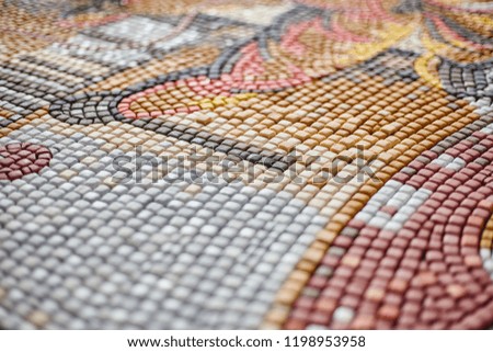 Perspective view of multicolored pieces of mosaic composed in picture