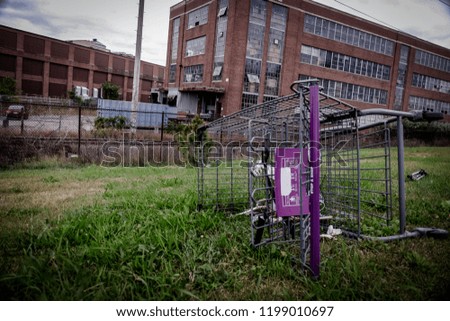 Shopping cart left outside a factory