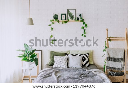 bedroom interior with a rustic loft bed with blankets and decor