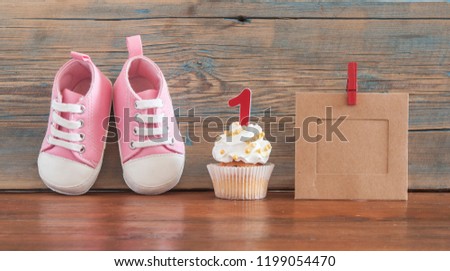 Festive background decoration for birthday celebration with delicious сupcakes for a baby shower on wooden background