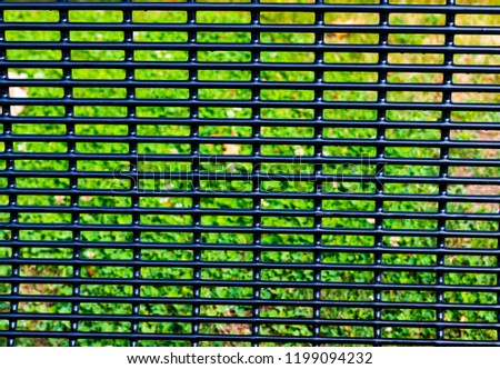 Abstract bench back grid with grass and brown leaves