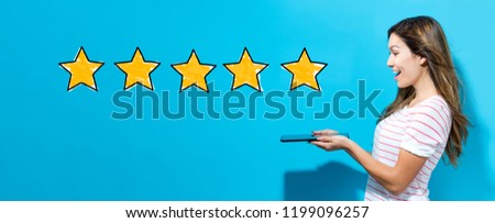 Five star rating with young woman using her tablet