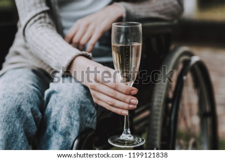 Girl on Wheelchairs with Man on Picnic in Park. Disabled Young Woman. Woman on Wheelchair. Relaxing in Summer Park. Picnic in Summer Park. Recovery and Healthcare Concepts. Cheerful People.
