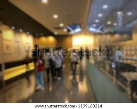 Blurred picture of people walking in seaweed exhibition hall