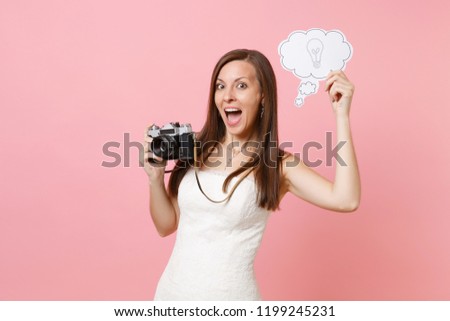 Excited bride woman in wedding dress hold retro vintage photo camera, Say cloud speech bubble with lightbulb choosing staff, photographer isolated on pink background. Organization, Wedding to do list