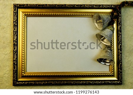 Photo frame, lettering, design and creativity, with gold ornament and festive Christmas silver bells, New year.