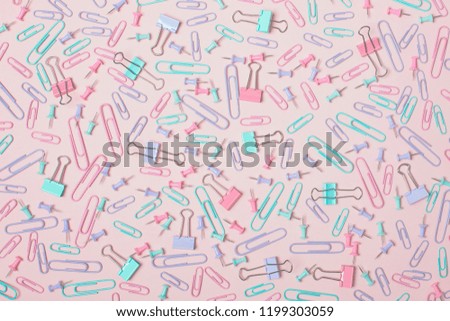 Colorful pastel background created with multiple office supplies
