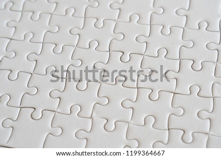 Background of white jigsaw puzzle.