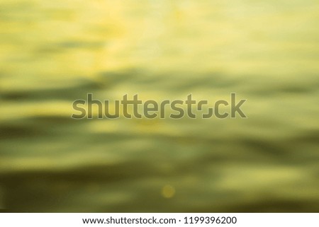 Colorful shiny green yellow tone ripple design river water surface, reflection, abstract natural freeform wave pattern backgroun. Peaceful sparkle screen, theme template. Vertical view . 