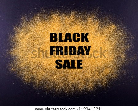 Black friday sale concept. Fourth Friday of November, beginning of Christmas shopping season since 1952. Black text on bright golden glitter background. Copy space, close up, top view, flat lay.
