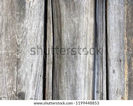 old wood texture damaged by rain and sun