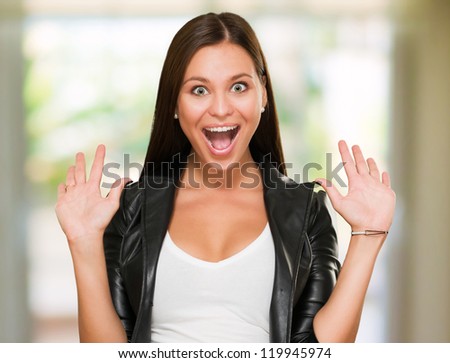 Portrait Of A Surprised Woman against an abstract background