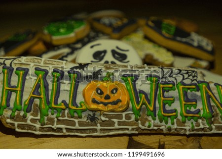 Closeup of Halloween cookies in the form of ghost figures, pumpkins, zombies. Halloween party sweets