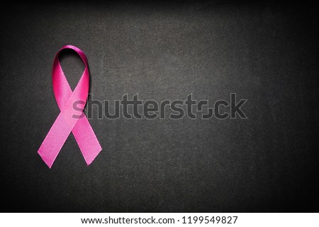 Pink ribbon for breast cancer awareness, symbolic bow color raising awareness on people living with women's breast tumor illness. bow isolated with clipping black background